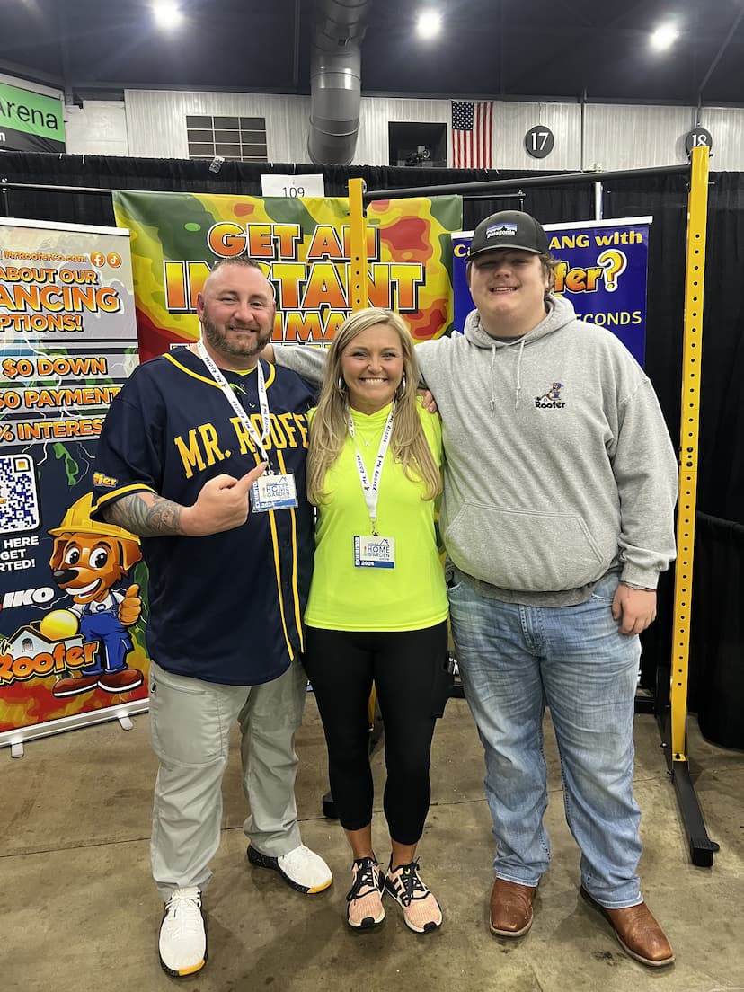 Jon Robinson, owner of Mr. Roofer, with his wife Keshia and son Logan at a home improvement expo